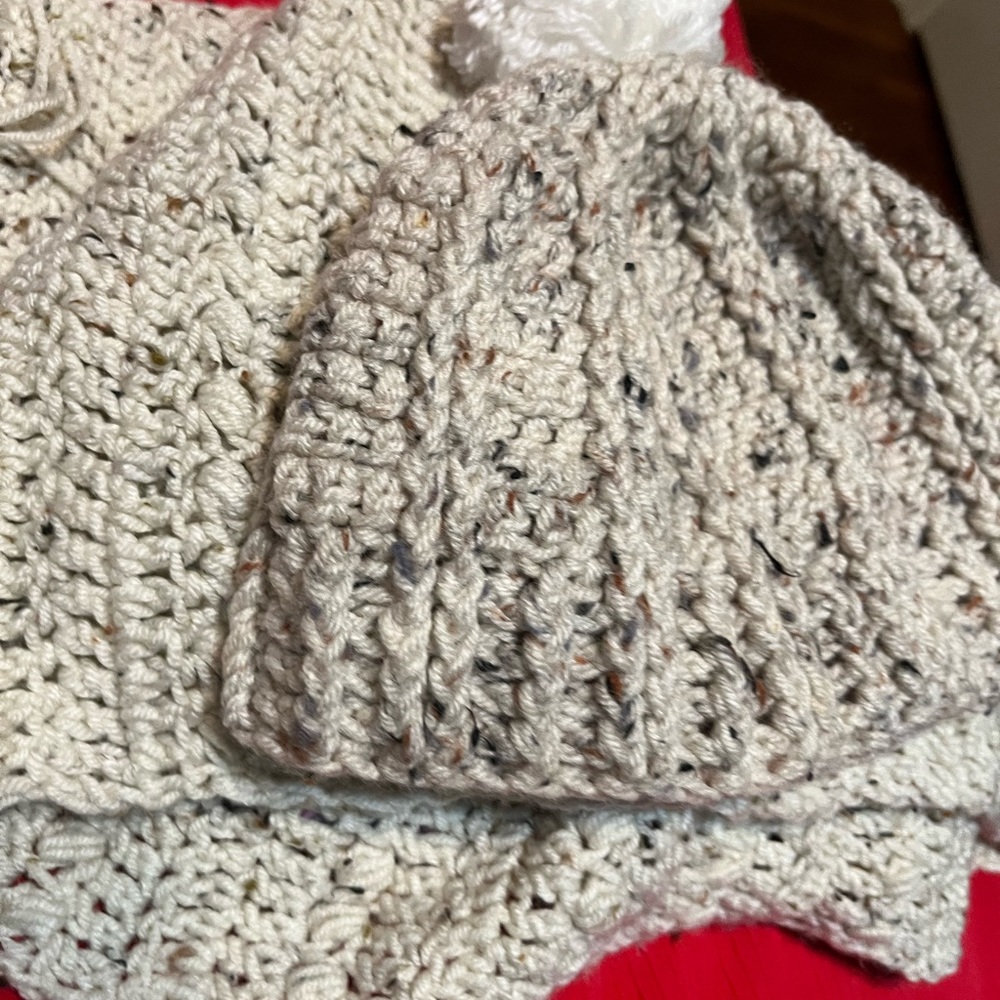 Hand knitted scarf, beige with fringe bottoms.